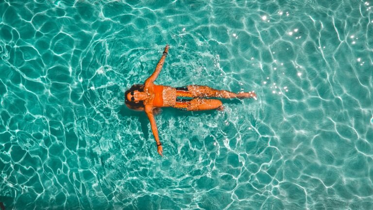 woman floating in a pool